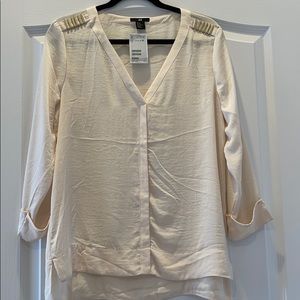 White blouse with gold hardware